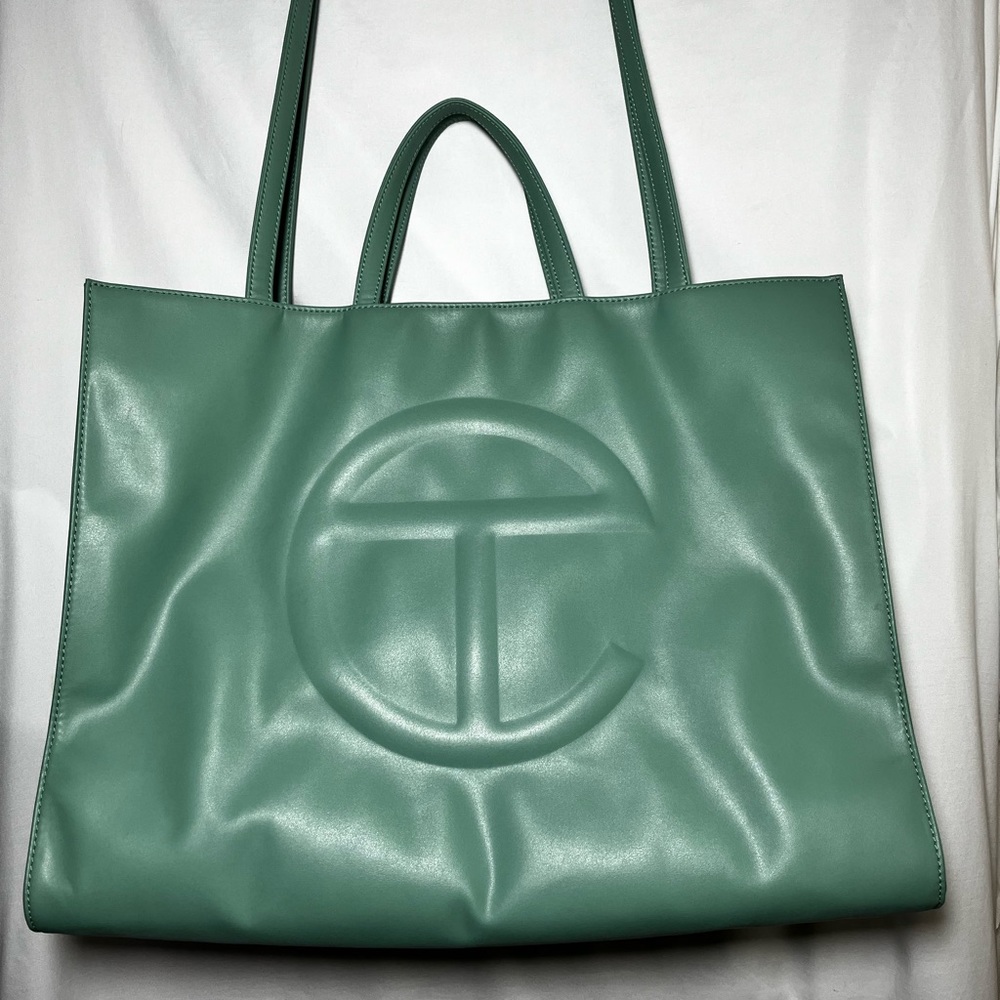 Sage green telfar large shopping bag.